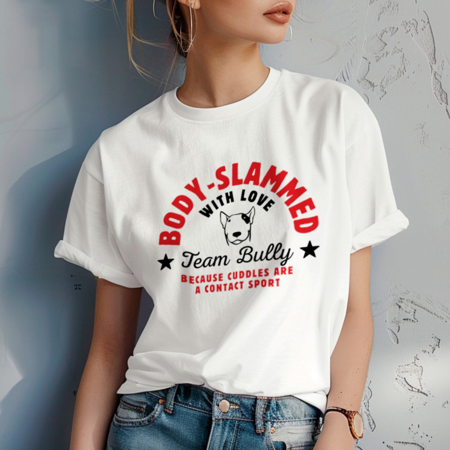 Person wearing a white t-shirt with a graphic design and text 'body-slammed with love'