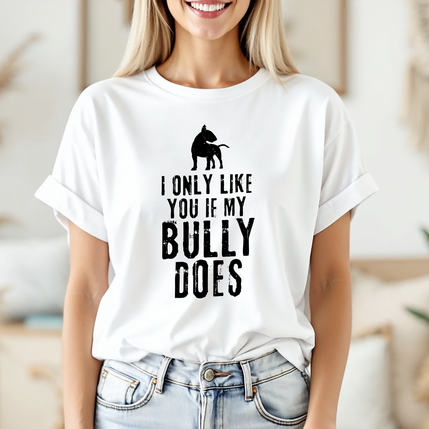 Woman wearing white t-shirt with bull terrier graphic and text "I only like you if my Bully does"