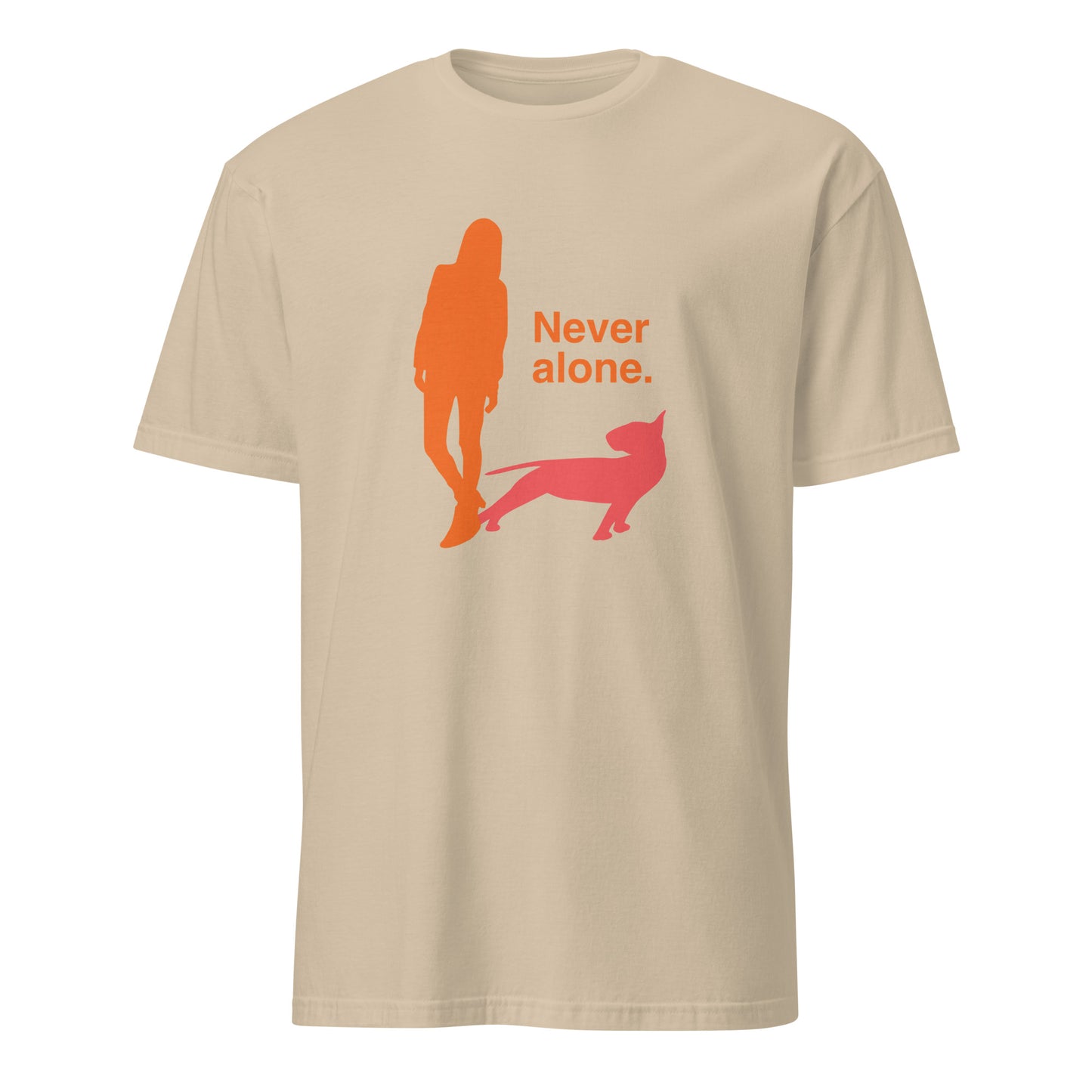 Product mockup of a sand t-shirt with a graphic of an orange figure and coral bull terrier shadow, and the text 'Never alone.'