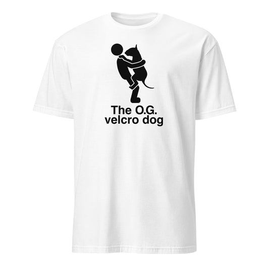 Product mockup of a white t-shirt with a graphic of a bull terrier jumping into a persons arms, and text 'The O.G. velcro dog'.
