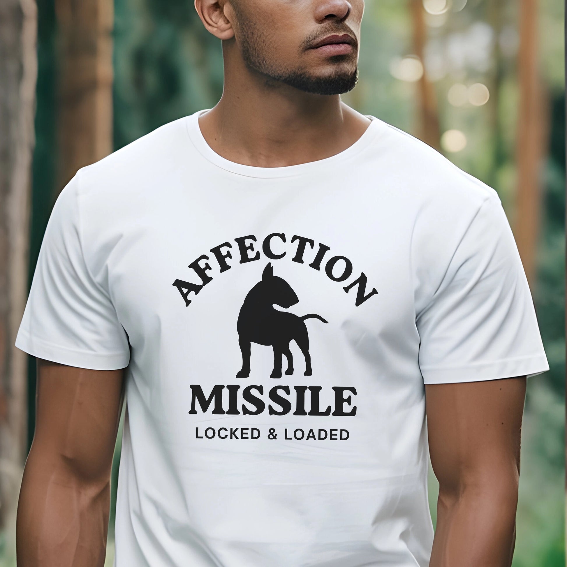 Person wearing a white t-shirt with black graphic and text "Affection Missile Locked & Loaded"