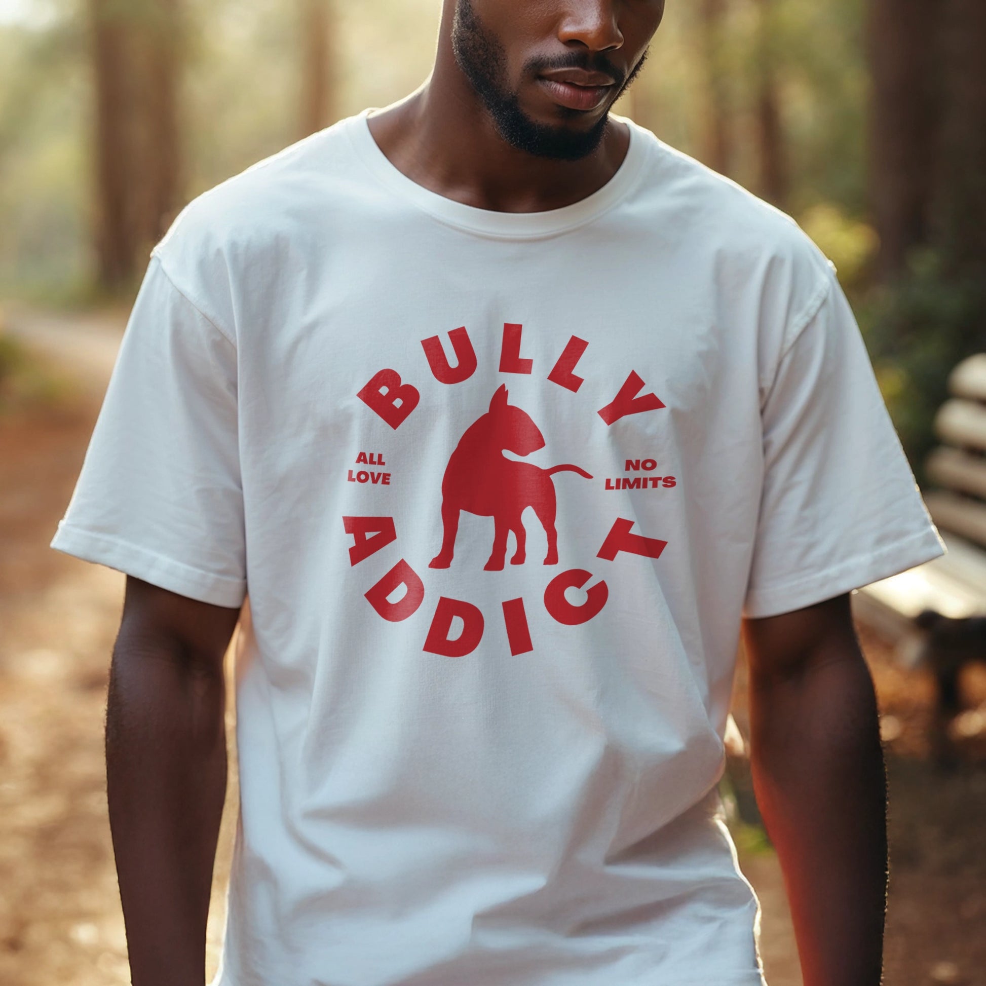 Man wearing a white t-shirt with red graphic and text Bully Addict 