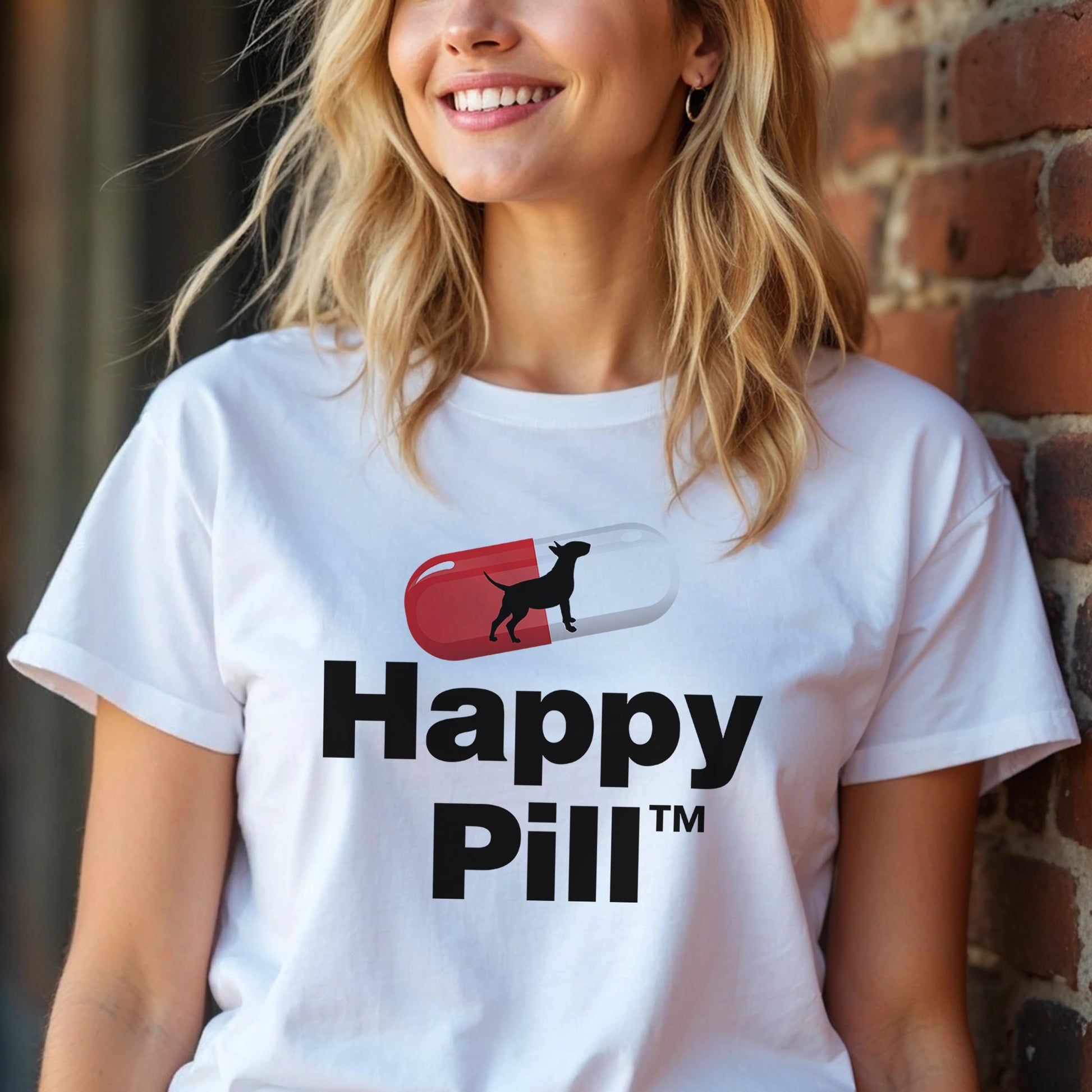 Person wearing a white t-shirt with 'Happy Pill' dog graphic design.