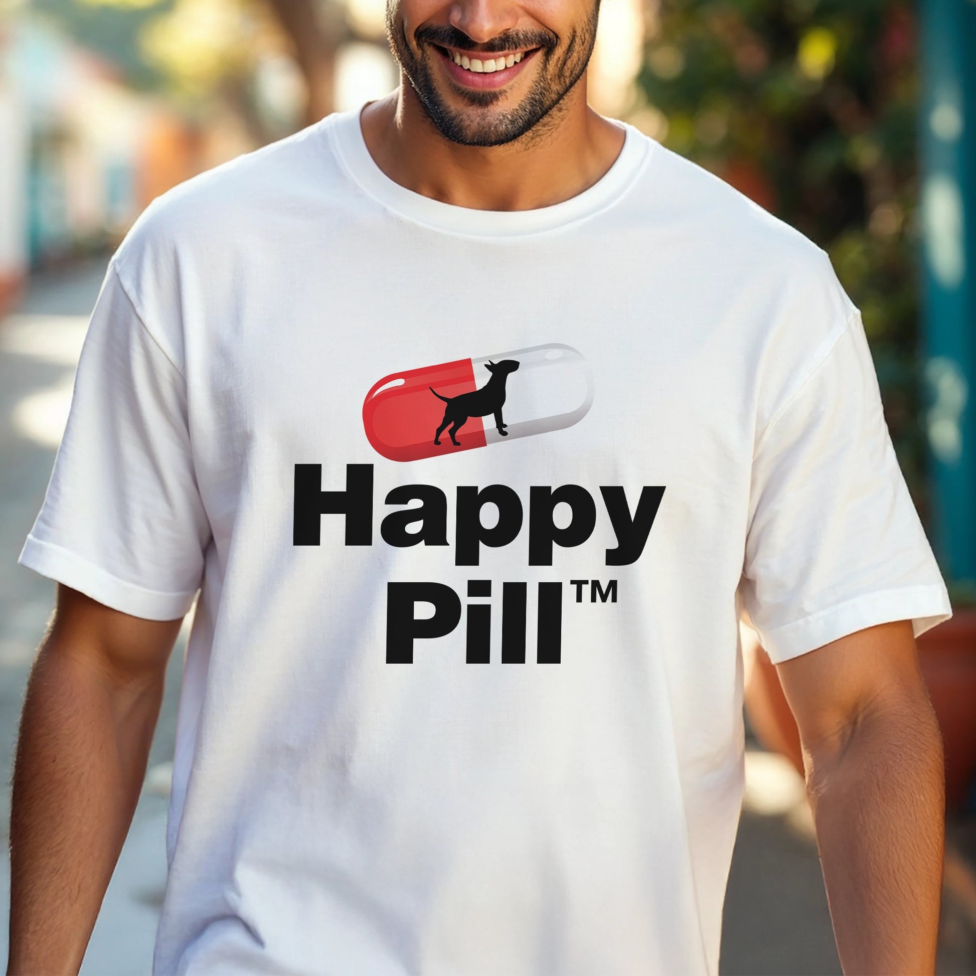Man wearing a white t-shirt with 'Happy Pill' dog graphic design.