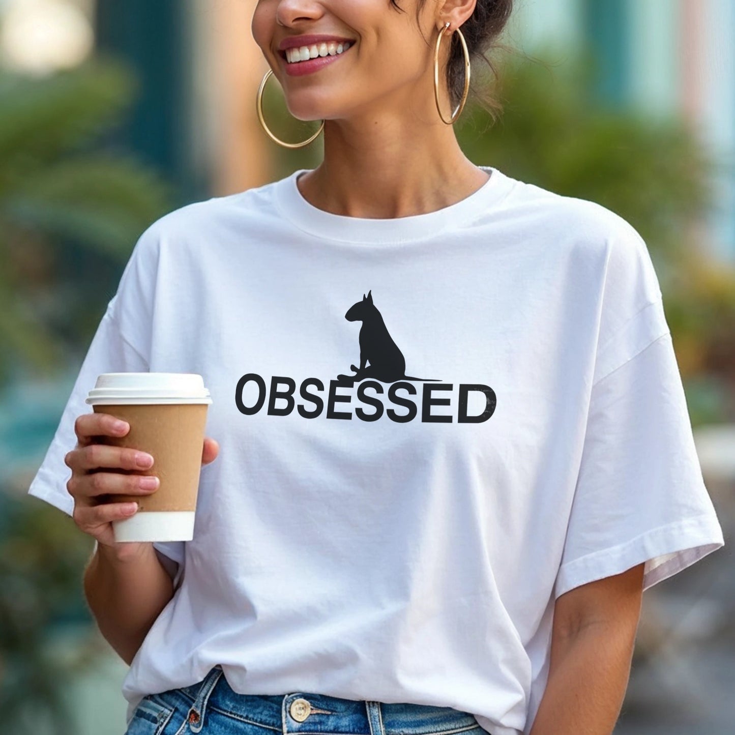 Person wearing a white t-shirt with a black bull terrier sitting silhouette and 'OBSESSED' text.
