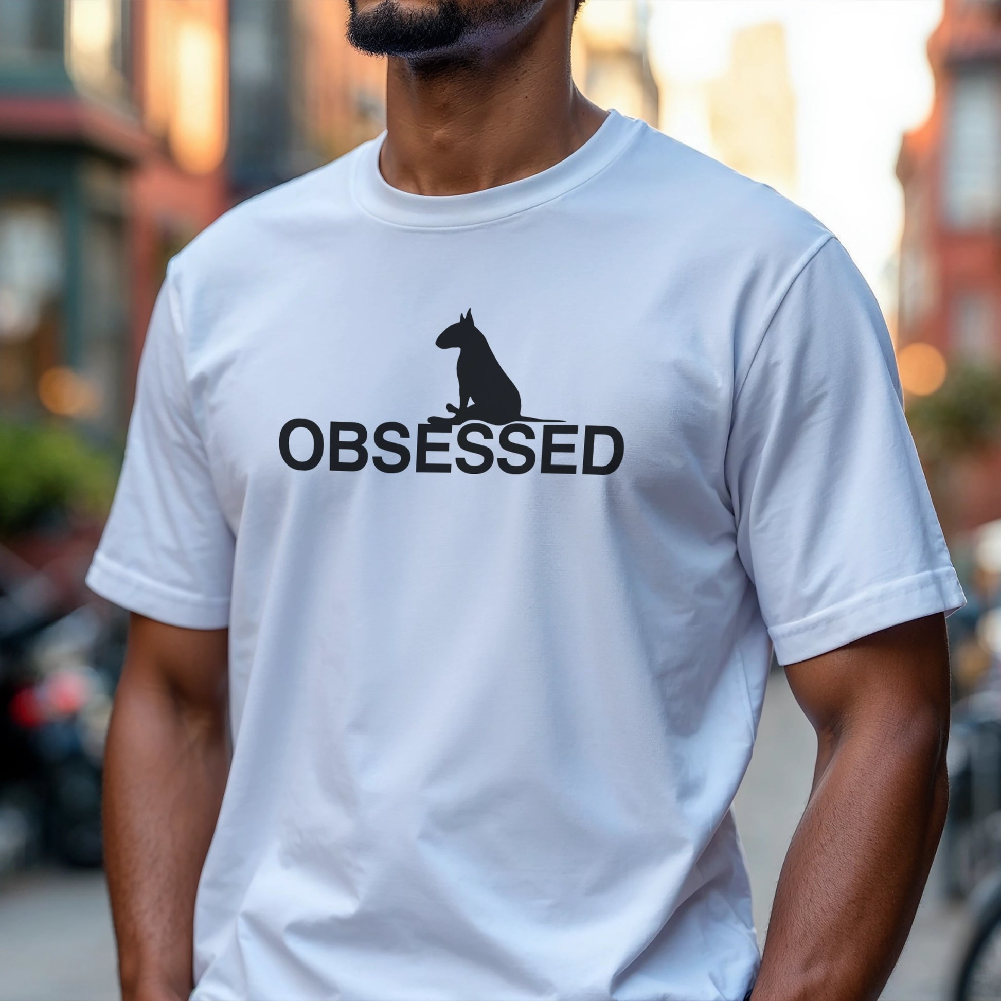 Person wearing a white t-shirt with a black bull terrier sitting silhouette and 'OBSESSED' text.