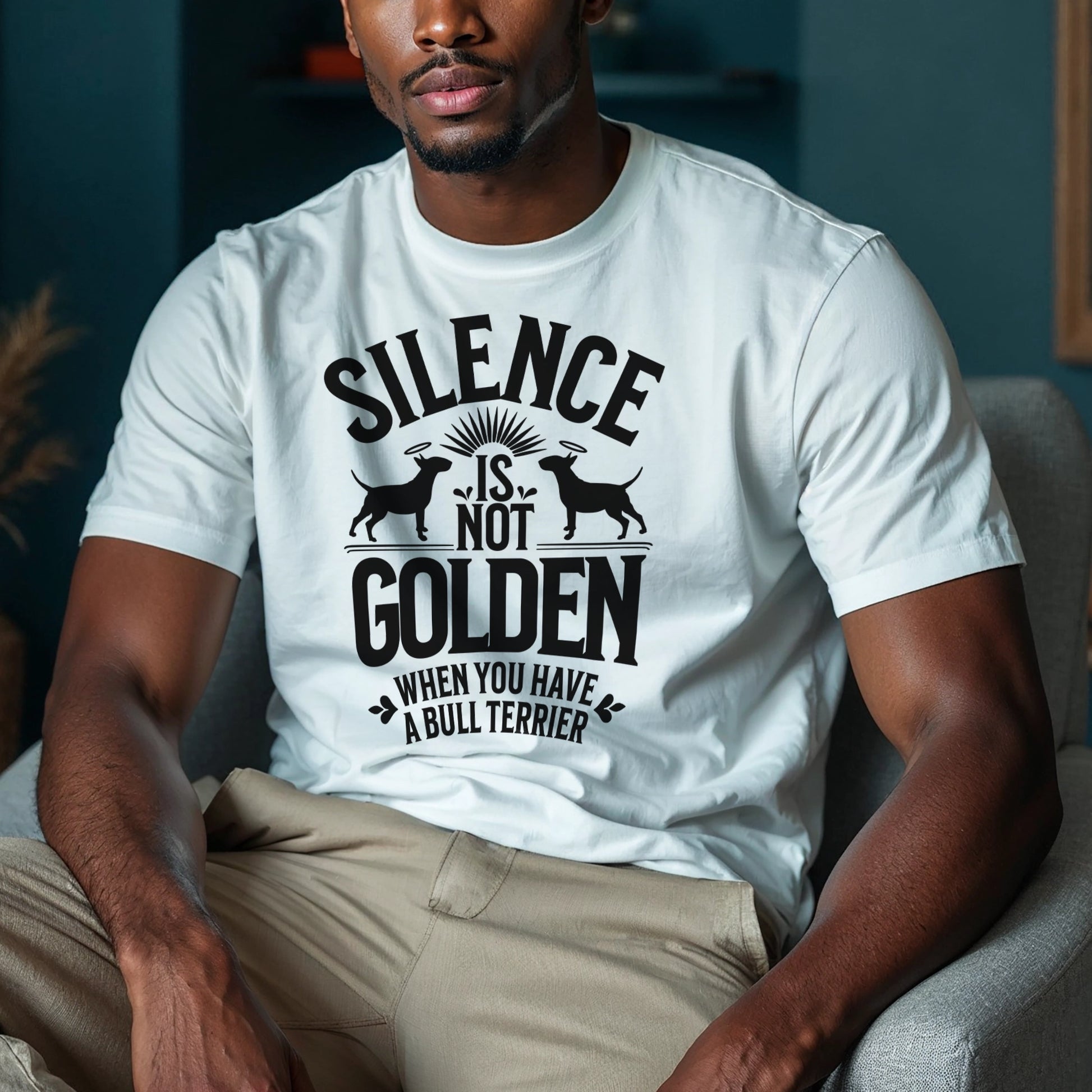 Man wearing a white t-shirt with a black graphic and text reading "Silence is not golden when you have a bull terrier."
