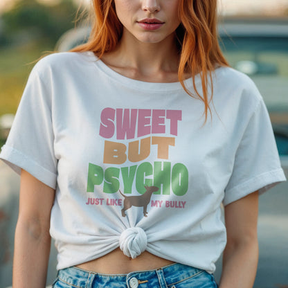 Person wearing a white t-shirt with colorful text reading "sweet but psycho just like my bully", with graphic of bull terrier.