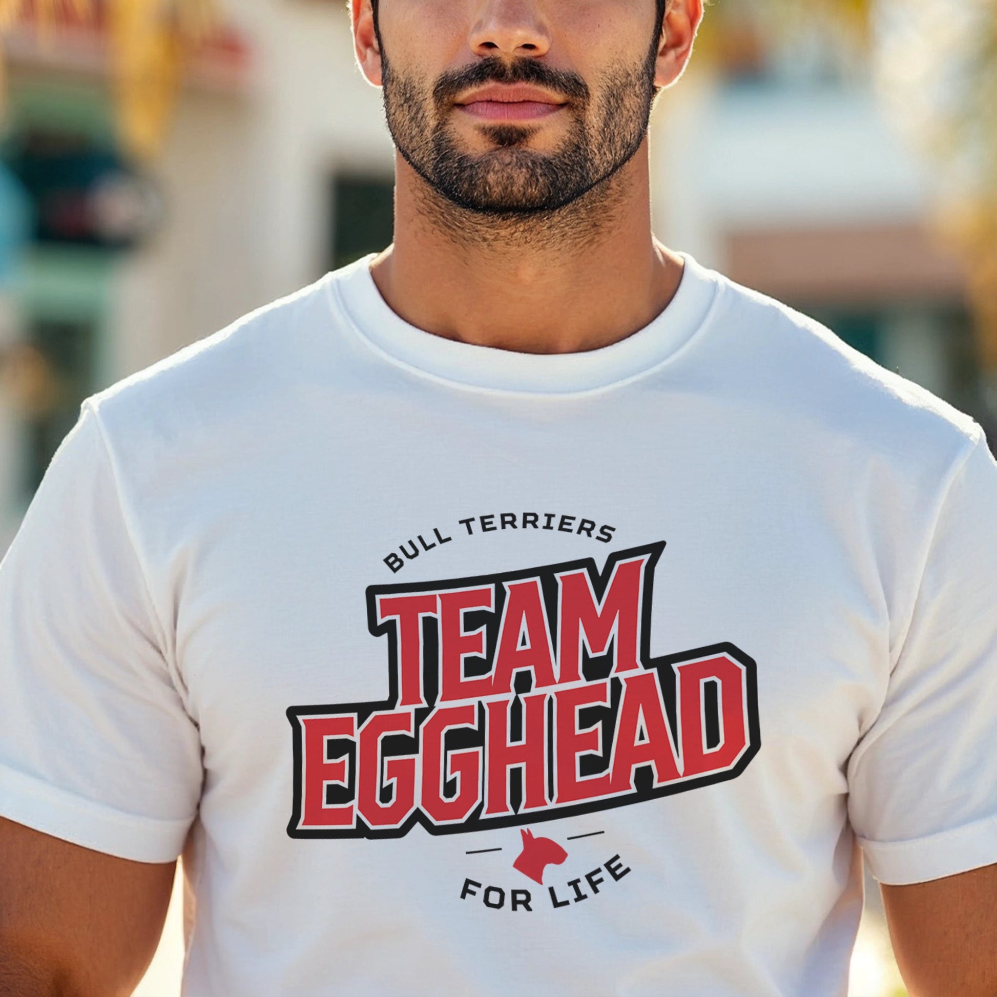 Man wearing a white t-shirt with 'Team Egghead for Life' text design.