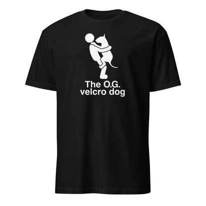 Product mockup of a black t-shirt with a graphic of a bull terrier jumping into a persons arms, and text 'The O.G. velcro dog'.