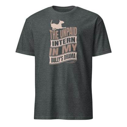 Product mockup of a dark grey t-shirt with a graphic text reading "The unpaid intern in my bully's drama", with a graphic of a playful bull terrier. 