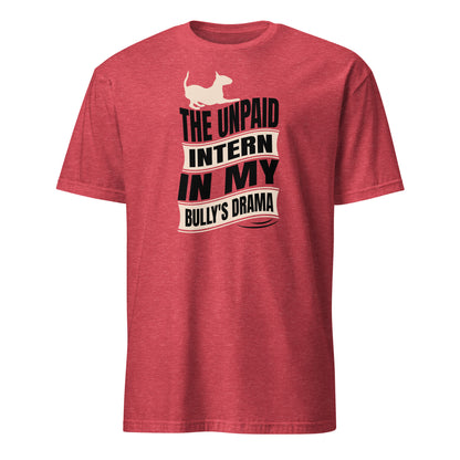 Product mockup of a red t-shirt with a graphic text reading "The unpaid intern in my bully's drama", with a graphic of a playful bull terrier. 