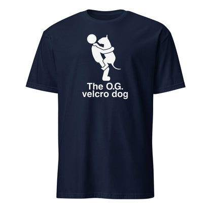 Product mockup of a navy t-shirt with a graphic of a bull terrier jumping into a persons arms, and text 'The O.G. velcro dog'.