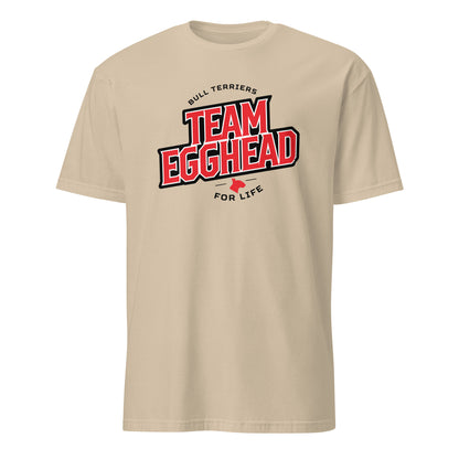 Product mockup of sand t-shirt with 'Team Egghead for Life' text and logo.
